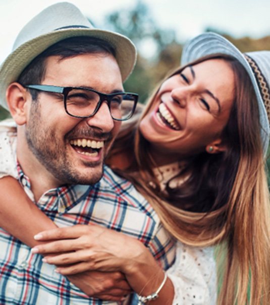 a man smiling with a dental bridge in Cherry Hill