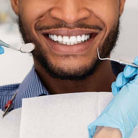 close up of man with beard's smile