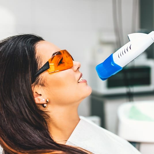 woman getting teeth whitening