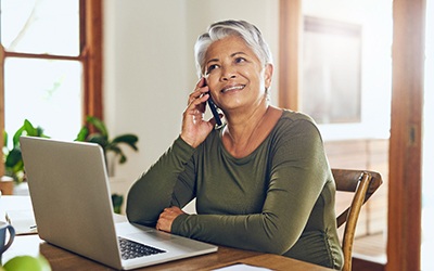 Woman with dentures talking on the phone