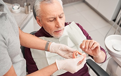 Man with dentures at the dentist