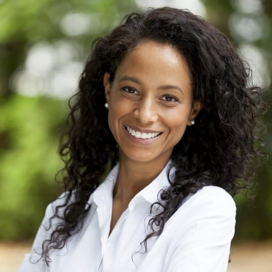 smiling woman with curly hair 