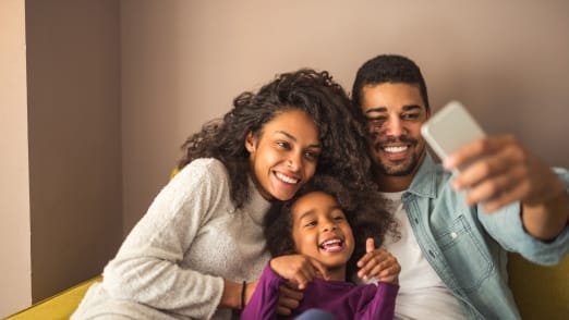 family of three taking selfie