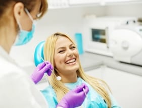 Young patient laughing in chair