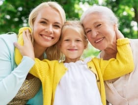 three generations of women smiling