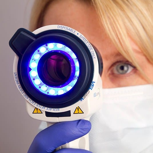 Dentist doing an oral cancer screening