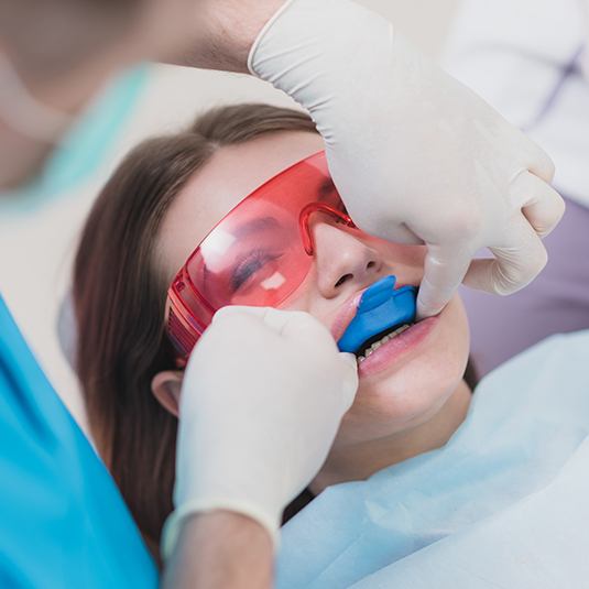 girl getting fluoride treatment