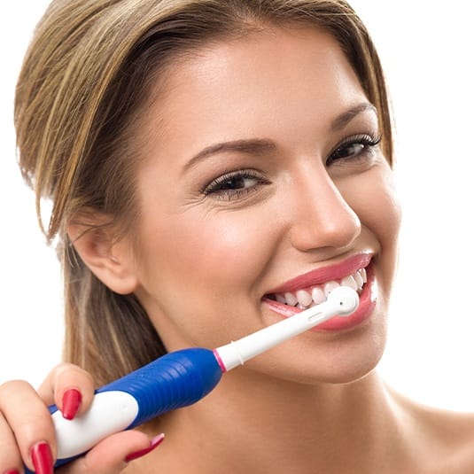 woman brushing teeth