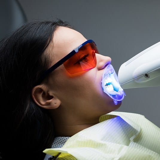 woman getting in office whitening treatment