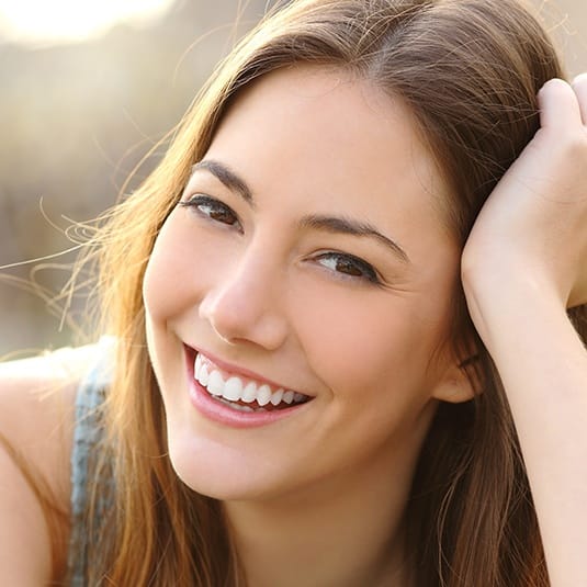 close shot of woman smiling outside
