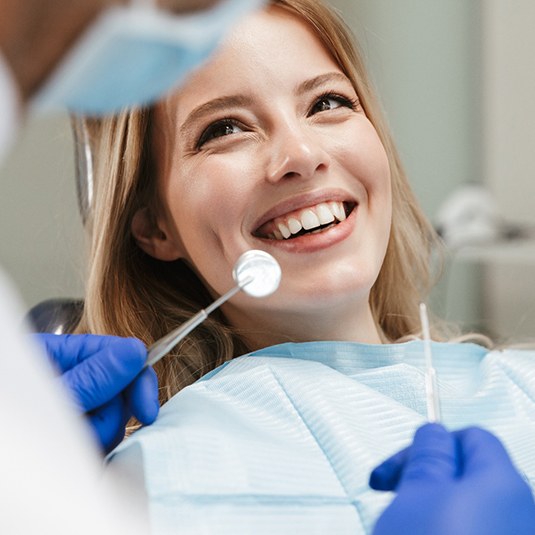 Patient considering teeth whitening at dentist