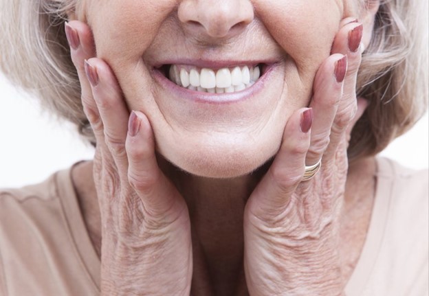 older person with dentures smiling 